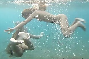 Julia and Masha are swimming nude in the sea poster