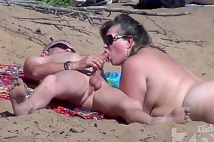 Blowjob on a nudist beach poster