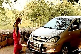 Indian bhabhi outdoor car wash   displaying deep cleavag poster