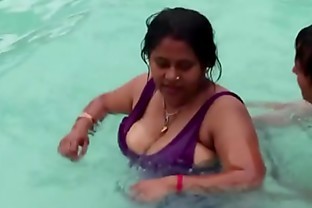 Hot sexy desi aunty showing assets in the pool poster