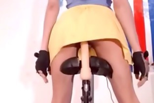 Teen riding dildo on bike poster