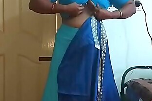 desi indian tamil aunty telugu aunty kannada aunty malayalam aunty kerala aunty hindi bhabhi horny cheating wife vanitha wearing saree showing big boobs and shaved pussy aunty changing dress ready for party and making video poster