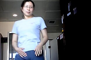 Asian Milf shows small tits ass and pussy in locker room poster