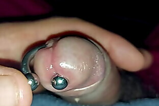 Playing with pierced cock