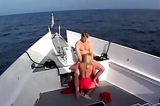 Sexy blonde in a red swimsuit sucks a tight cock of an excited stud with pleasure and gets a mouthful of cum
