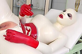 Busty Latex Lucy spanks her ass & fills her creamy pussy with clinic sex toy poster