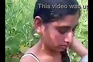 Desi girl removing clothes in field. poster