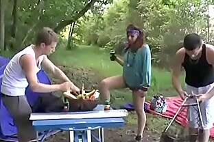 A girl fucked hard by two guys in a camping poster