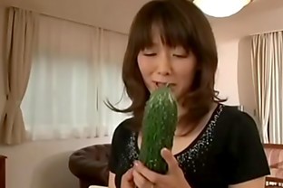Japanese mother masturbating with a big cucumber poster