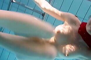 Redhead Mia stripping underwater poster